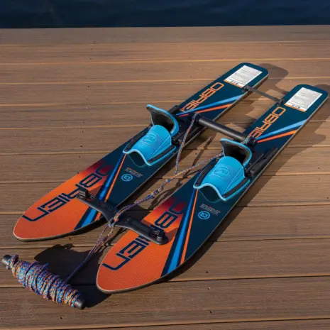 Obrien All Star Trainer Waterskis Detail 03 O'Brien All-Star Trainer Waterskis with training rope attached and handle resting on dock.