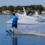 Man combo waterskiing off a malibu boat