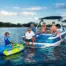 Family on a boat with a child on the O'Brien Simple Trainer Inflatable Ski in a lake.