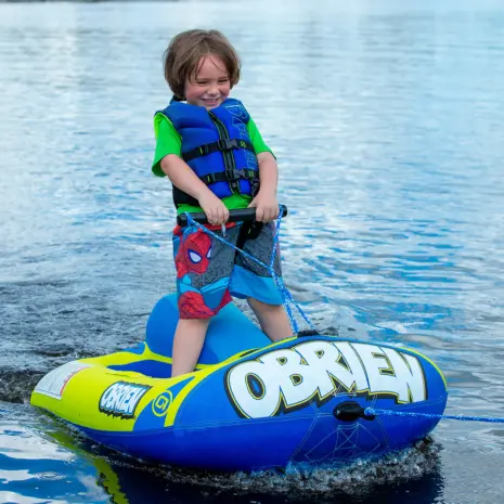 Obrien Simple Trainer Inflatable Ski Lifestyle 06 Child using the O'Brien Simple Trainer Inflatable Ski on a calm lake.