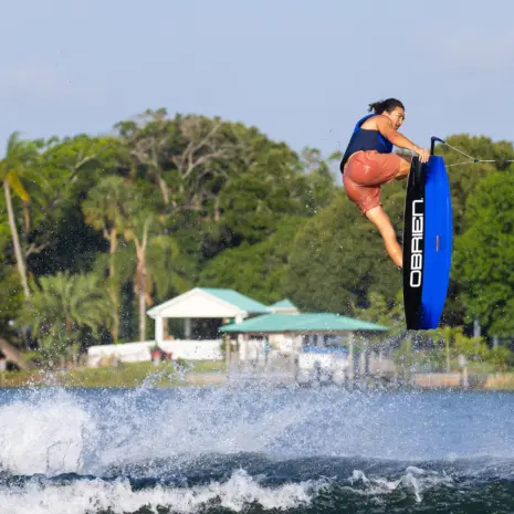 O’Brien System 140 Wakeboard Lifestyle Rider performing a tail grab on an O’Brien System 140 wakeboard