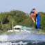 Rider performing a tail grab on an O’Brien System 140 wakeboard