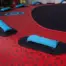 Close-up view of padded blue handle on X-Scream towable tube deck.