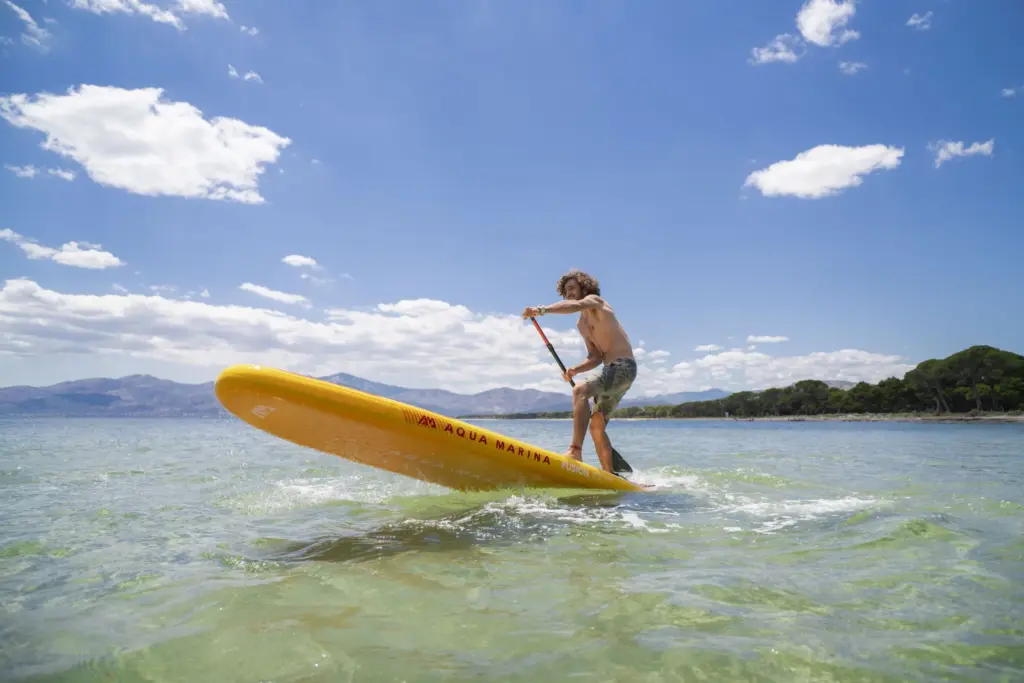 XtremeMarine Homepage — Browser Review Revision 2026 2 Paddler turning a yellow Aqua Marina FUSION stand-up paddle board on clear water