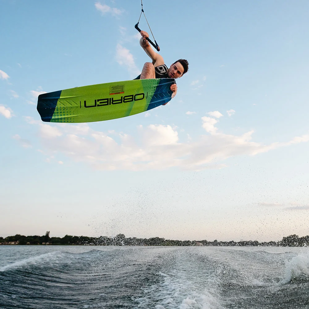 O’Brien wakeboarder performing an aerial grab above calm lake water