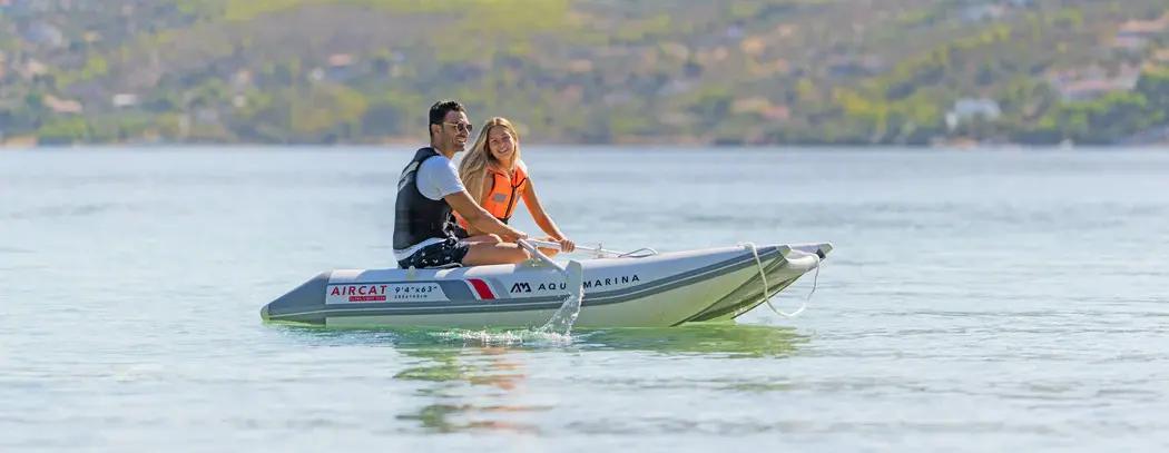 Aqua Marina AIRCAT 9'4″ Inflatable Catamaran 1 Aqua Marina AIRCAT - two people aboard an inflatable catamaran on a lake