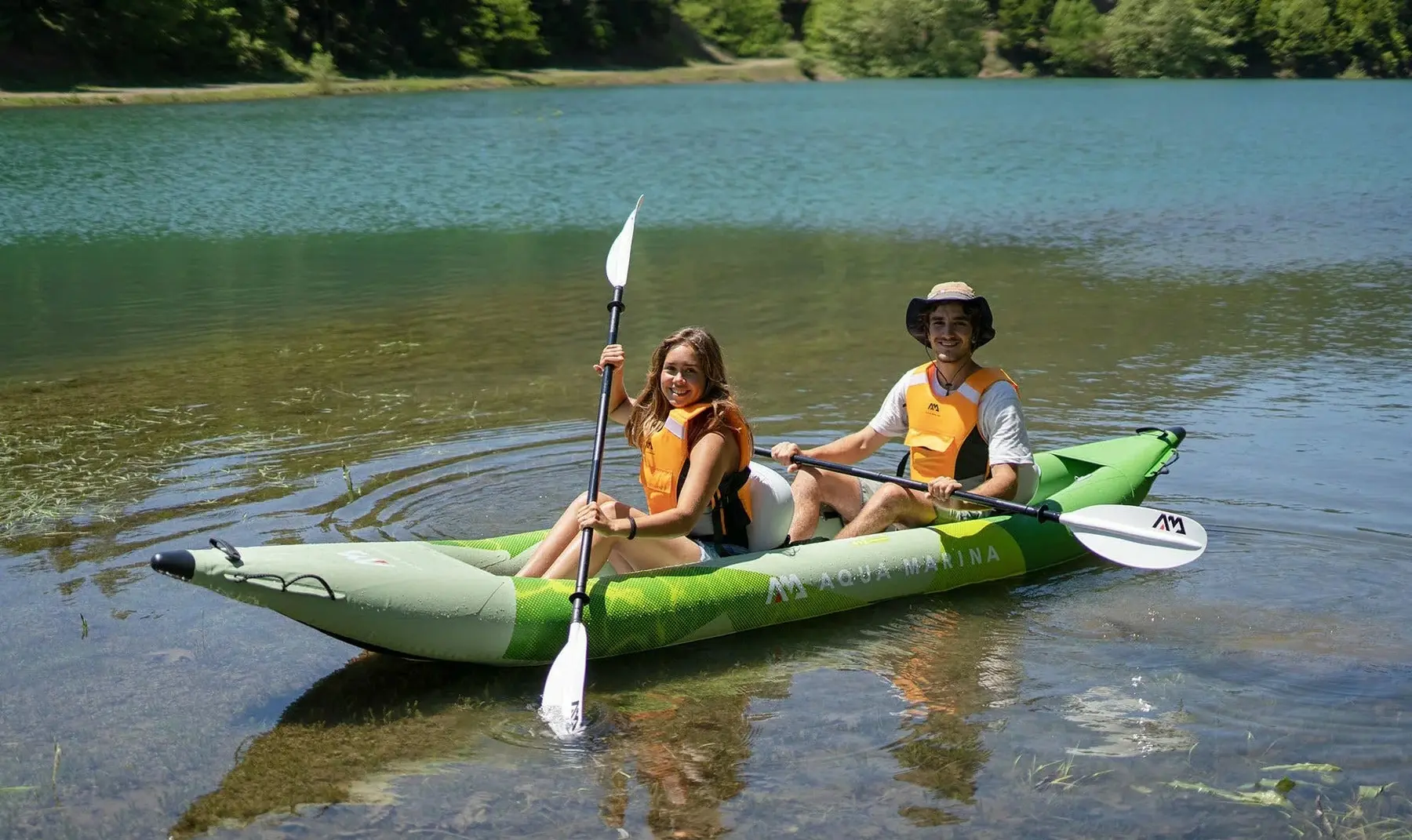 Aqua Marina BETTA 412 13′6″ Double Kayak 1 Aqua Marina BETTA 412 - two paddlers in a tandem kayak beside the shore