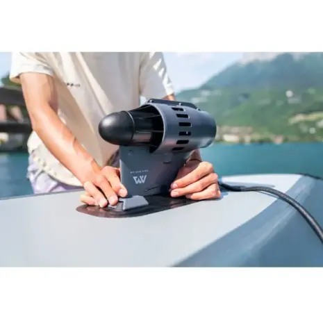 Aqua Marina BlueDrive propulsion units - person fitting the unit to a board Aqua Marina BlueDrive propulsion units - person fitting the unit to a board
