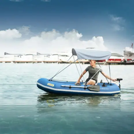 Aqua Marina Boat Canopy - person seated beneath the canopy on a boat Aqua Marina Boat Canopy - person seated beneath the canopy on a boat