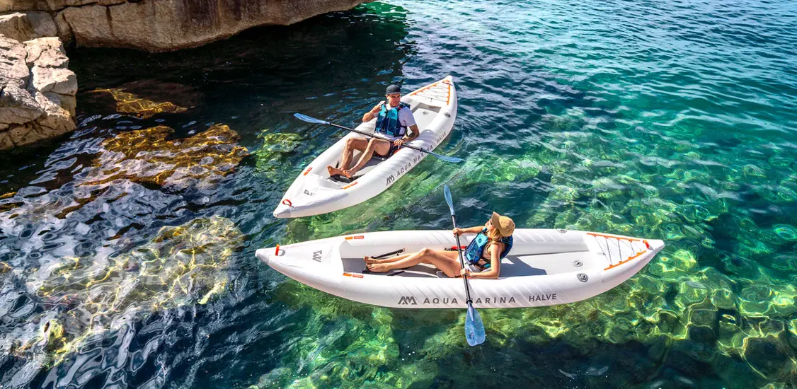 Aqua Marina HALVE Single/Double Kayak 1 Aqua Marina HALVE - two paddlers in separate kayaks on clear water