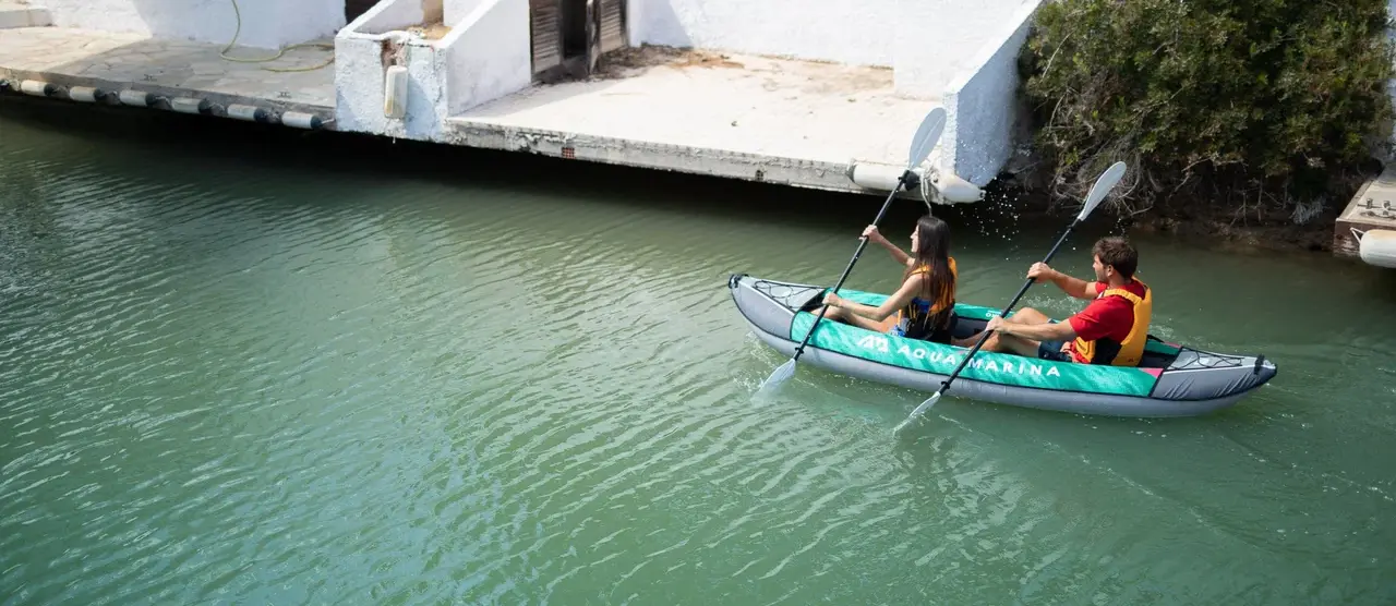 Aqua Marina LAXO 320 10′6″ Double Kayak 1 Aqua Marina LAXO 320 - two paddlers in a tandem kayak on the water