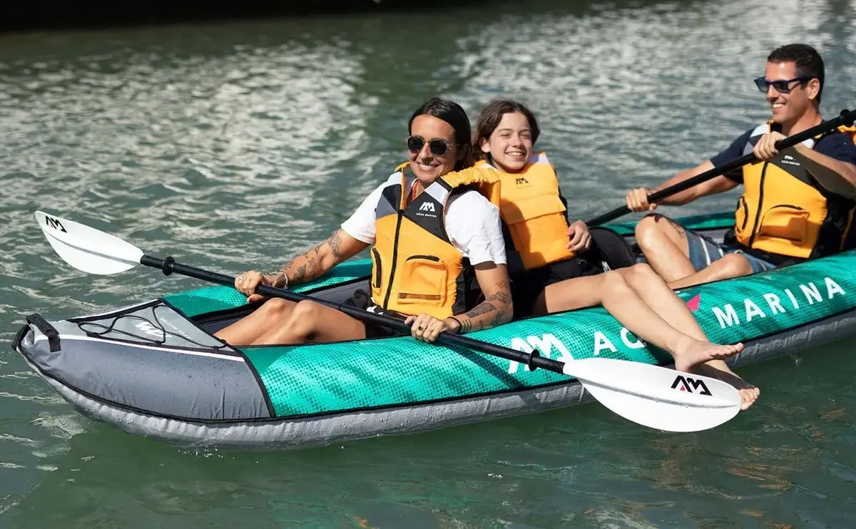 Aqua Marina LAXO 380 12′6″ Triple Kayak 1 Aqua Marina LAXO 380 - three people seated in a kayak on the water