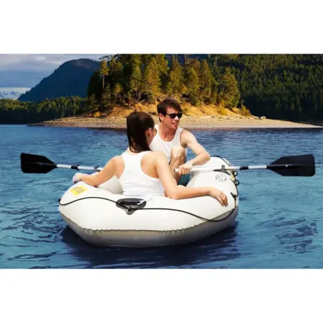 Aqua Marina MOTION - two people paddling the boat on the water Aqua Marina MOTION - two people paddling the boat on the water