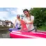 Aqua Marina SWIFT RACING fin - person fitting a pink fin to a paddle board