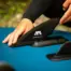 Aqua Marina slide-in river fin - person fitting the fin to a paddle board