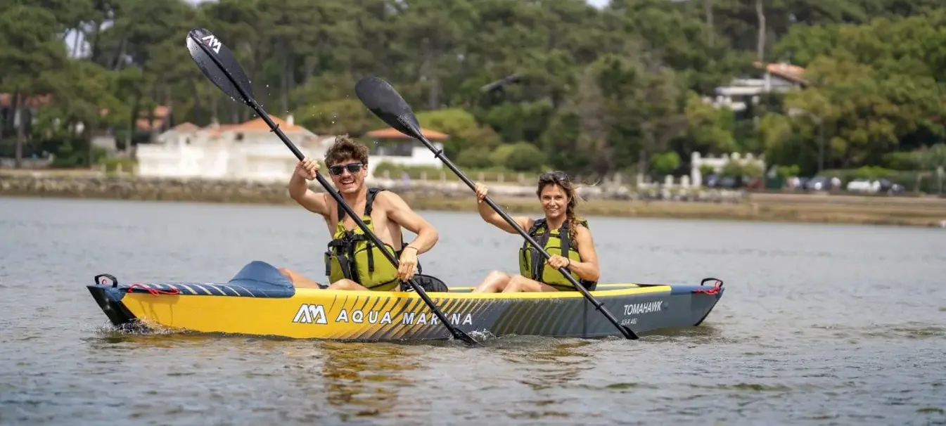Aqua Marina TOMAHAWK AIR-K 440 Double Kayak 1 Aqua Marina TOMAHAWK AIR-K - two paddlers in a tandem kayak on the water
