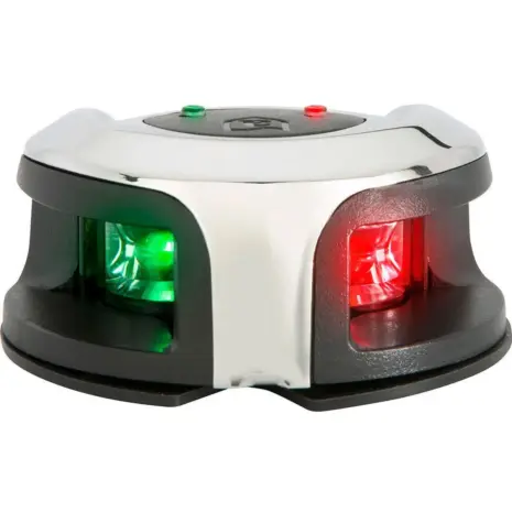 Attwood oval bi-colour navigation light - angled view of the polished housing with illuminated green and red lenses Attwood oval bi-colour navigation light - angled view of the polished housing with illuminated green and red lenses