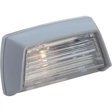 Attwood surface-mount courtesy light - angled view of the grey housing and clear ribbed lens Attwood surface-mount courtesy light - angled view of the grey housing and clear ribbed lens