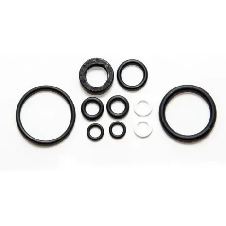 SeaStar HS5153 cylinder seal kit - black and white rings and seals arranged on white SeaStar HS5153 cylinder seal kit - black and white rings and seals arranged on white